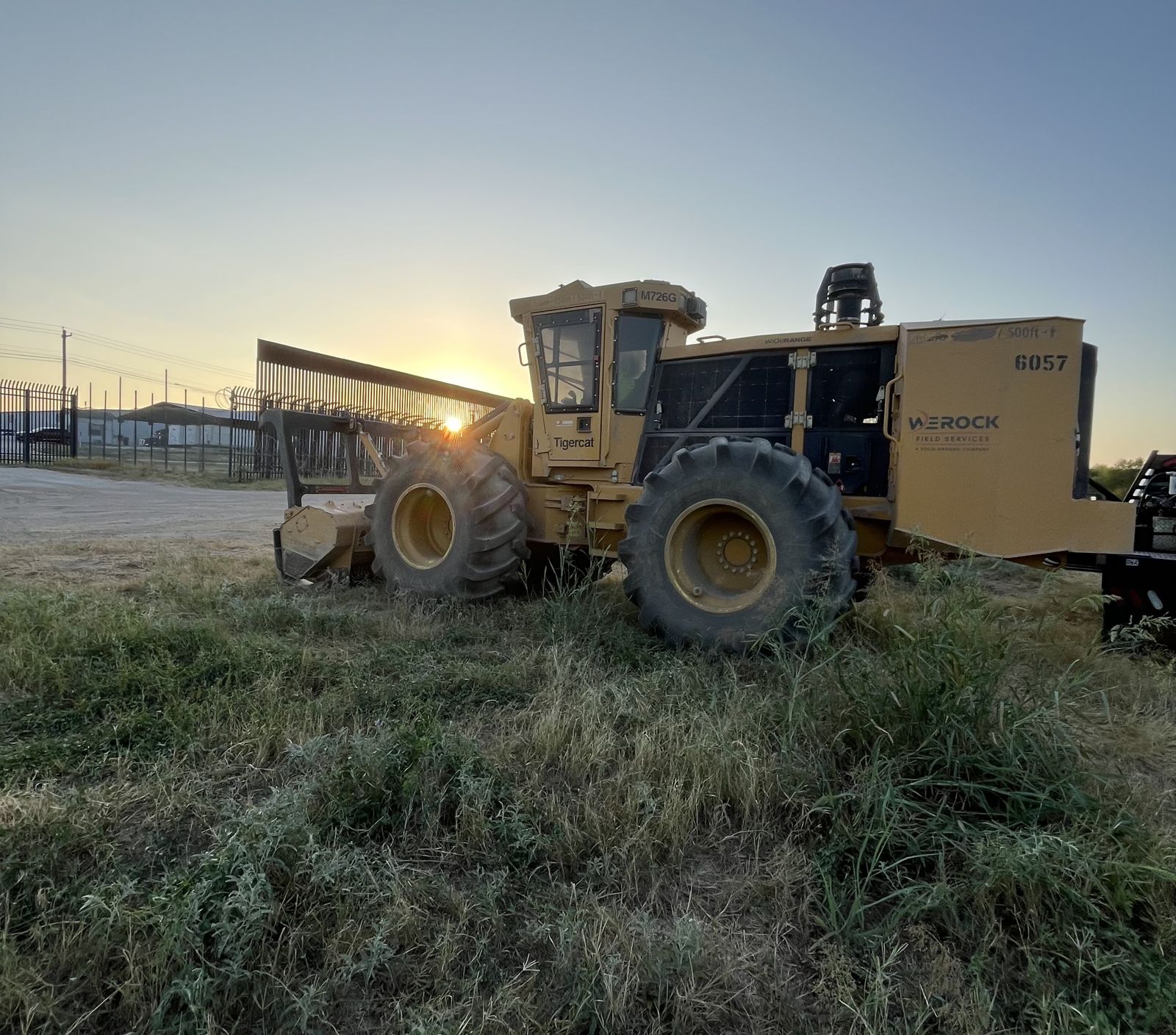 Tigercat mulcher at sunrise on a southern border clearing project