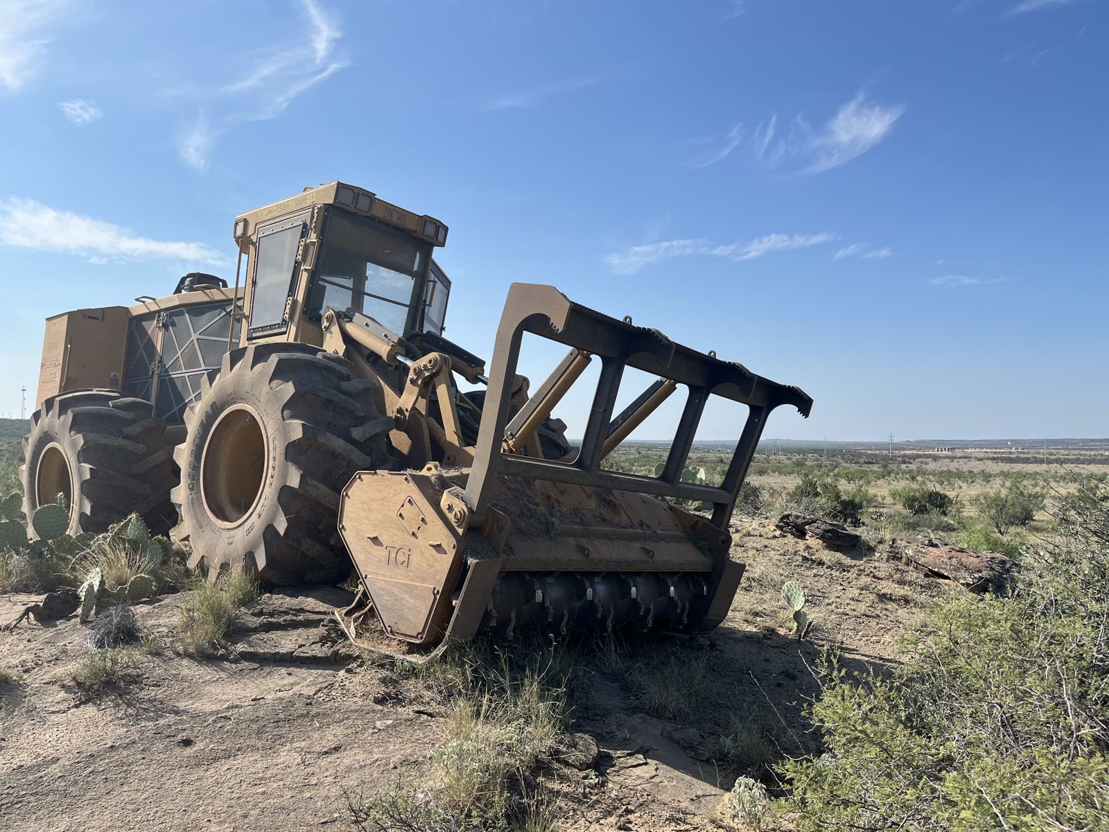 Tigercat mulcher with TCI head clearing a rocky ridge in West Texas